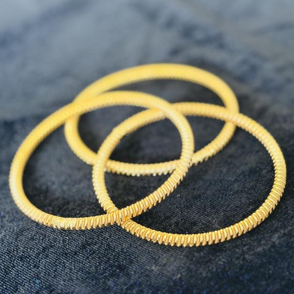 Gold plated coiled bangle for women