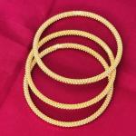 Gold plated coiled bangle for women