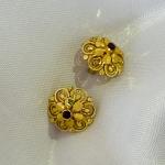 Gold plated flower stud earrings with small red stone for women